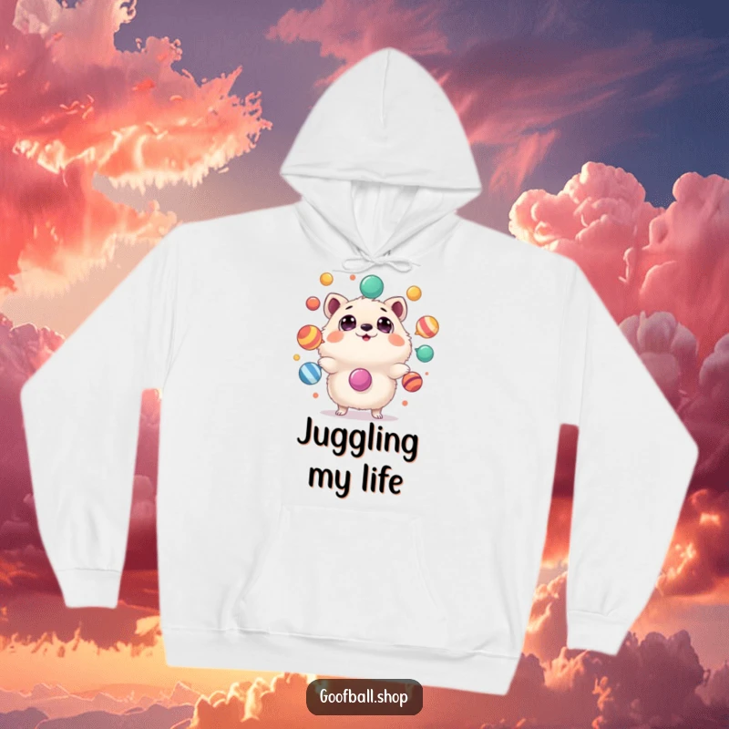 Funny Hoodie: A bewildered, fluffy animal with wide eyes attempts to juggle a chaotic assortment of colorful, unstable items.