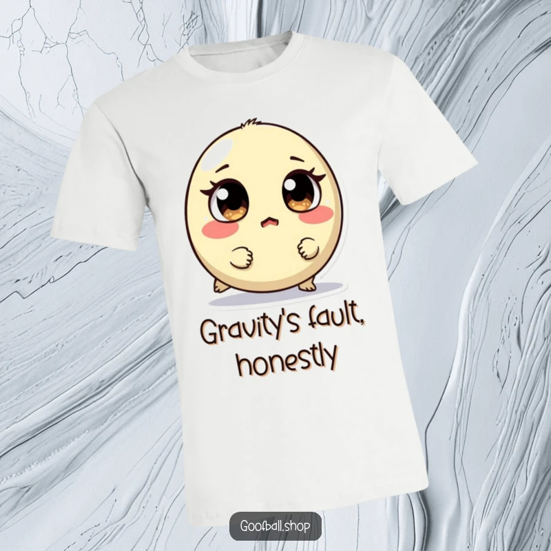 Funny t-shirt featuring a small, round creature with mismatched eyes tripping over its feet, looking surprised and adorably clumsy.